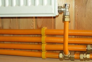 Use of corrugated pipes in heating