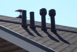 Installation of a ventilation pipe on the roof of a private house