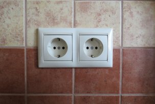 How to install a socket on a tile: how to make a hole