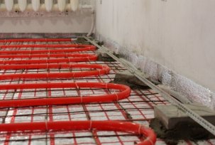 Installation of underfloor heating in apartments with central heating